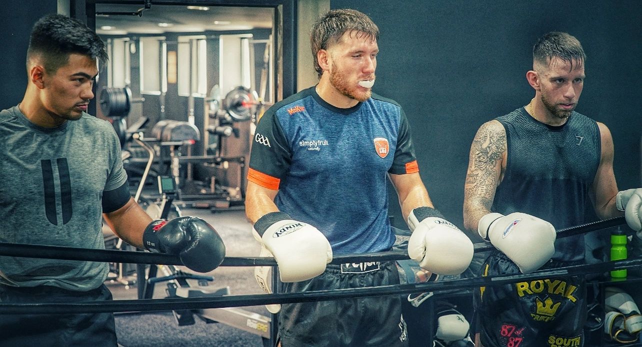 Boxing training group gym athletes sparring