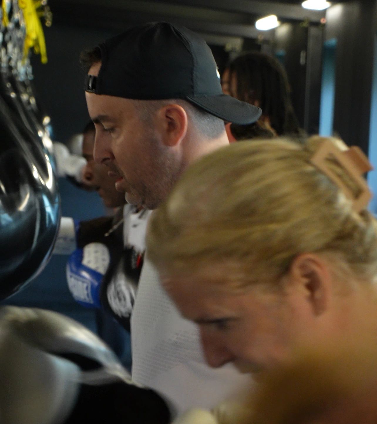 Woman blonde boxing focused training gym